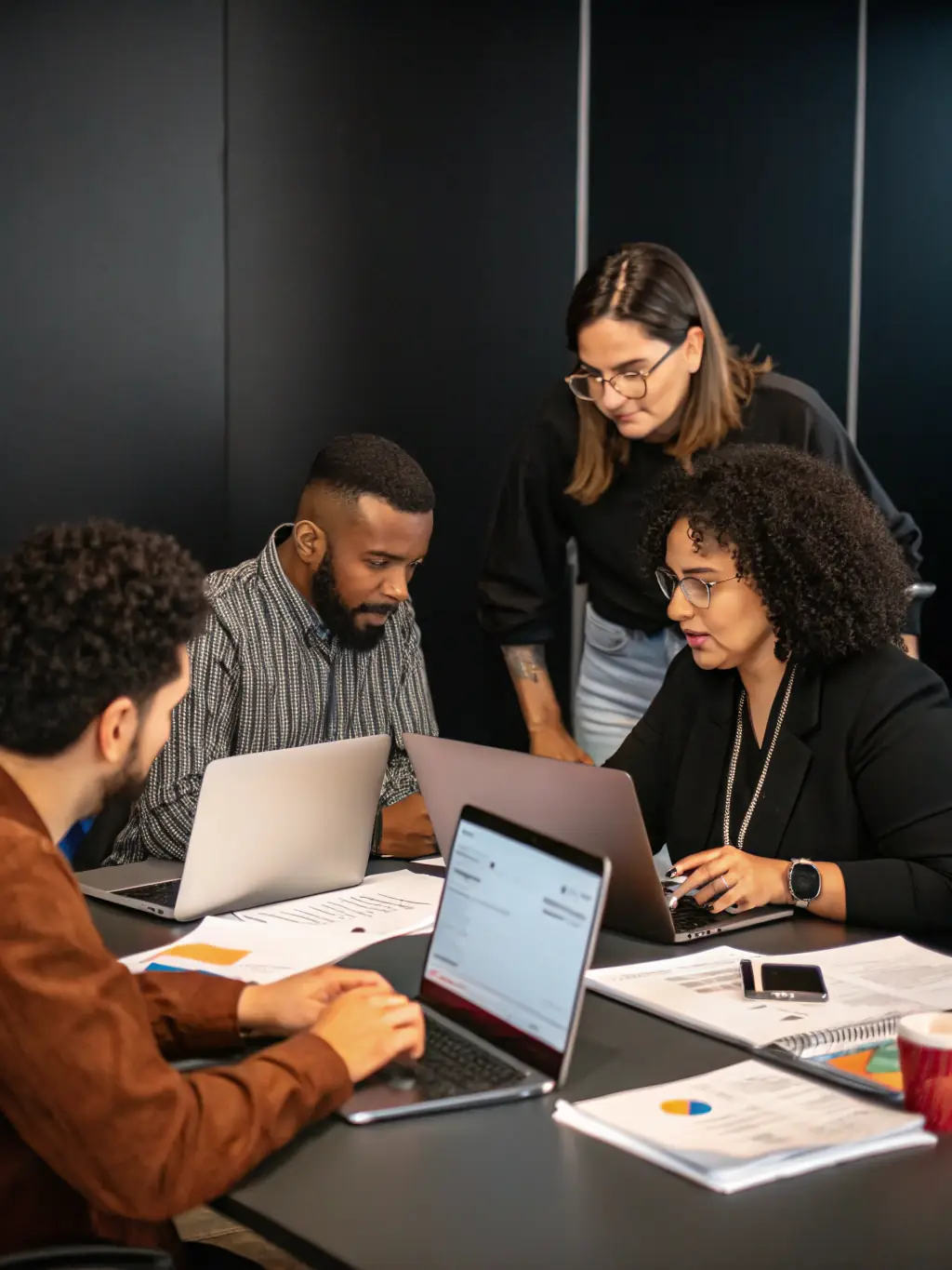 A professional photograph of a diverse team collaborating during an onboarding session, emphasizing teamwork and integration.